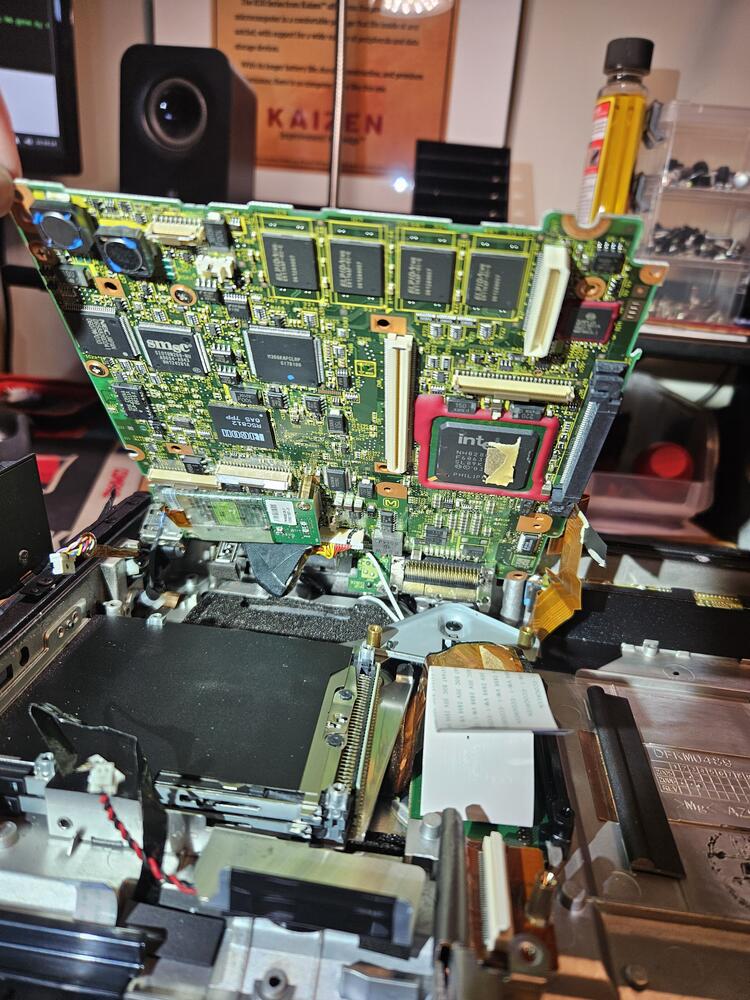 The full shot of the bottom of the lifted motherboard.