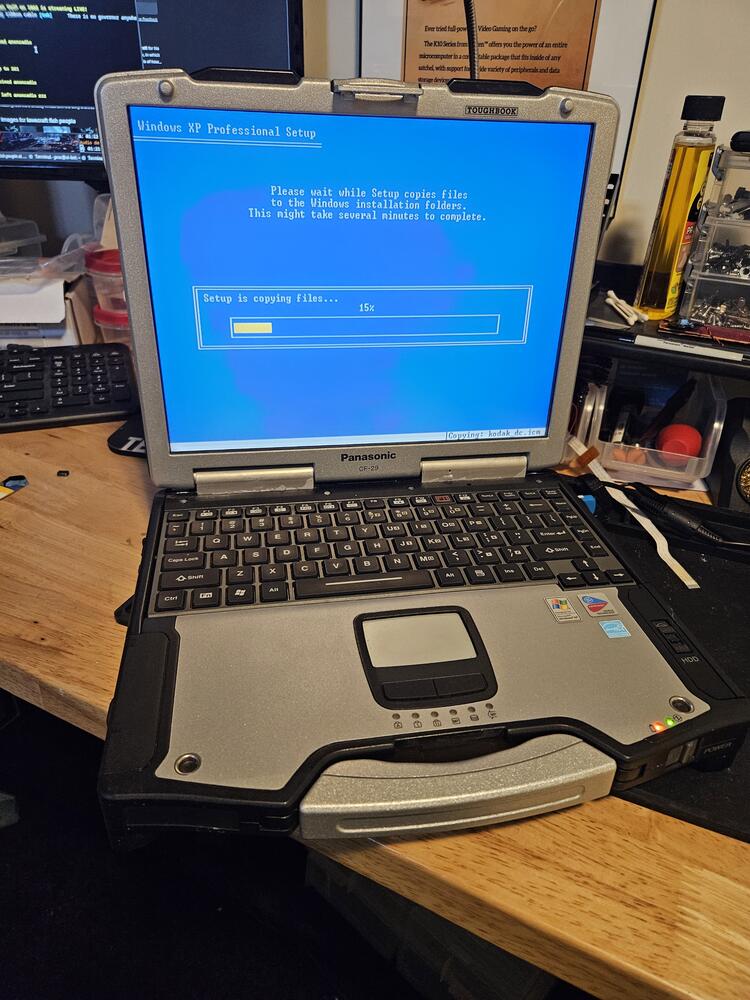 The Toughbook shown open and running during an install of Windows XP